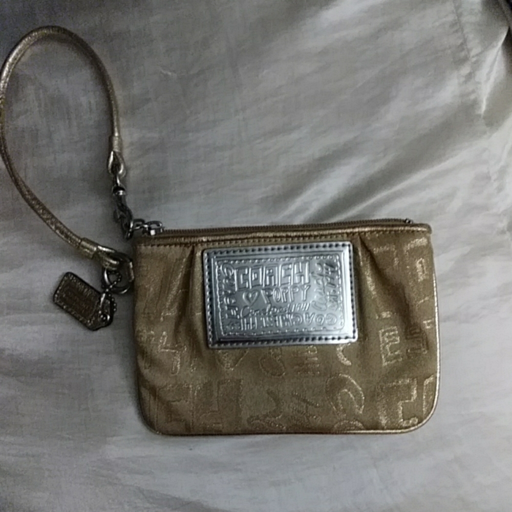 Gold coach wristlet